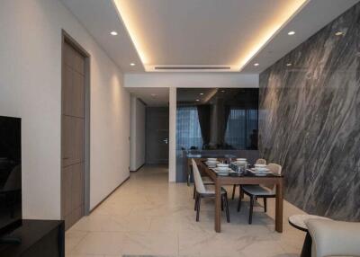 Modern dining area with marble wall