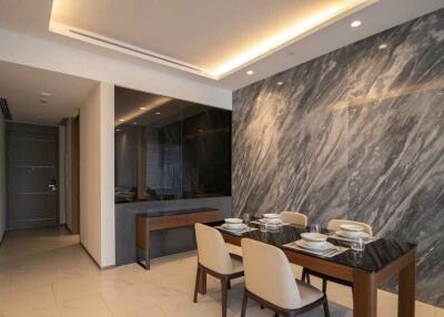 Modern dining room with marble accent wall