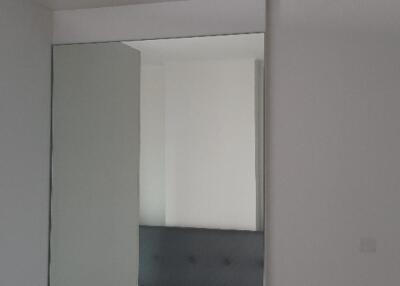 Wall mirror and air conditioner in bedroom
