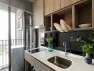 Modern kitchen with sink, counter, and outdoor view