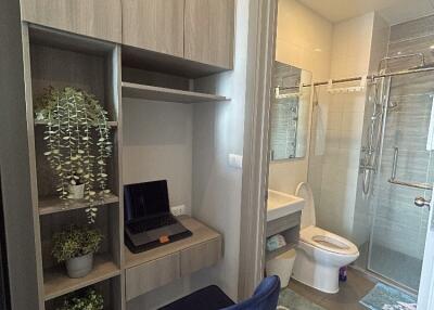 Modern bathroom with nearby workspace