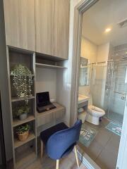 Modern bathroom with nearby workspace