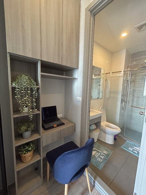 Modern bathroom with nearby workspace