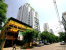 Modern urban buildings with greenery and street view