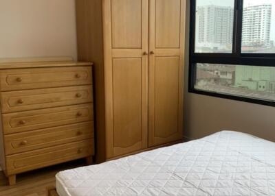 Bedroom with wooden furniture and window view