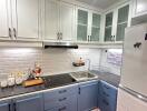 Modern kitchen with tiled backsplash and ample cabinetry