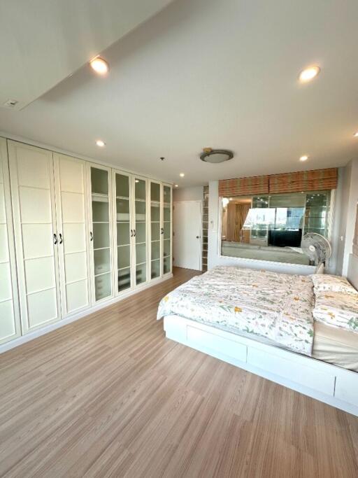 Spacious bedroom with modern design and ample storage