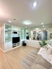 Modern living room with built-in shelves and TV