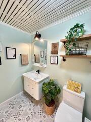 Modern bathroom with plants and decor