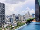 High-rise buildings and rooftop swimming pool with city skyline