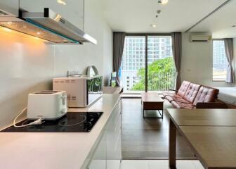 Modern kitchen and living area with natural light