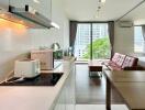 Modern kitchen and living area with natural light