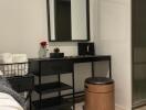 Bedroom vanity area with a mirror and stool