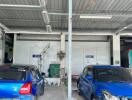 Garage with two parked blue cars