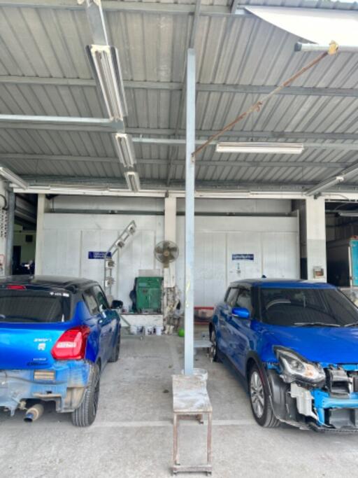 Garage with two parked blue cars