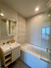 Modern bathroom with bathtub and vanity