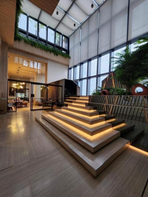 Modern atrium with staircase and large windows