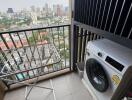 Balcony with washing machine and view of the city