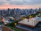 Rooftop terrace with city skyline at sunset