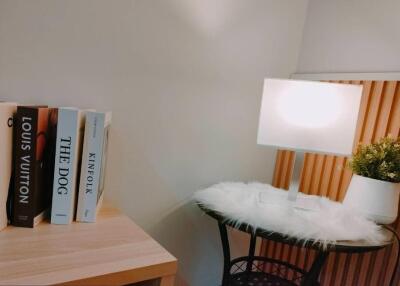 Cozy corner with books and lamp