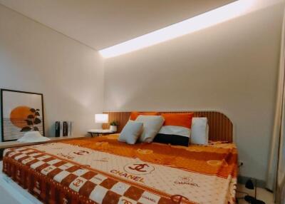 Stylish bedroom with modern decor and ambient lighting