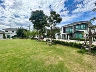 Exterior view of modern houses with well-maintained lawn