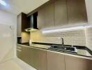 Modern kitchen with brown cabinets and subway tile backsplash