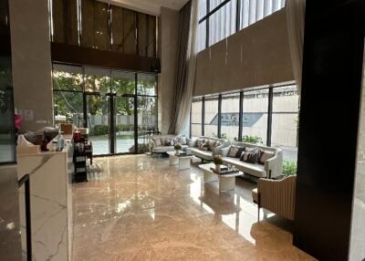 Luxurious lobby area with seating and large windows