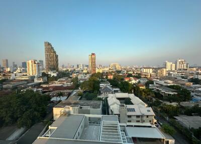 Rooftop view of a city with residential and commercial buildings