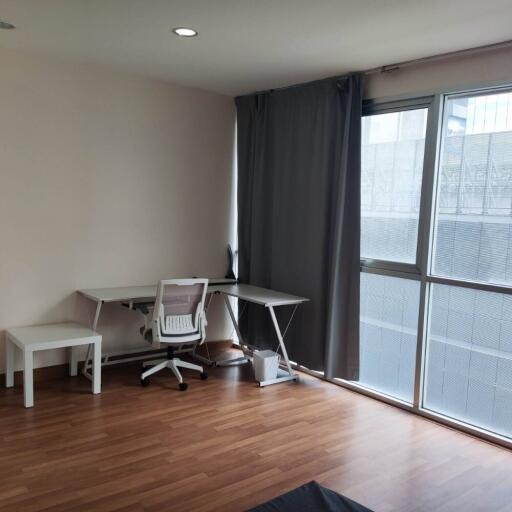 Living area with modern furniture and large window