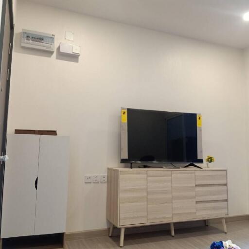 Modern living room with TV on a wooden cabinet