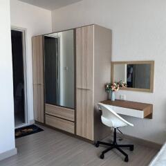 Bedroom with wardrobe, desk, and chair