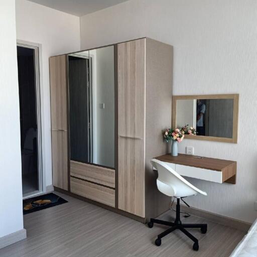 Bedroom with wardrobe, desk, and chair