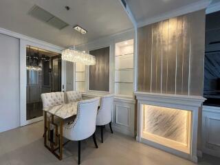 Elegant dining room with marble table and modern chandelier