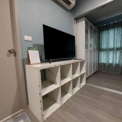 Living area with TV and storage unit