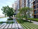 Modern apartment complex with garden and water features