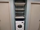 Laundry area with washer and shelving