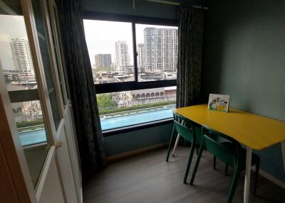 Small dining area with a window view and yellow table