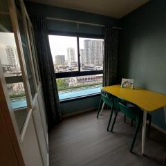 Small dining area with a window view and yellow table