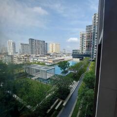 View from building exterior with garden and other high-rise buildings