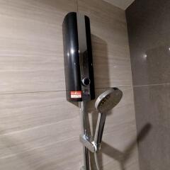 Water heater and shower head in bathroom