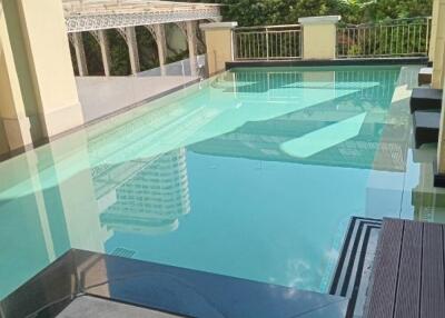 Swimming pool with surrounding buildings