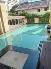 Swimming pool with surrounding buildings