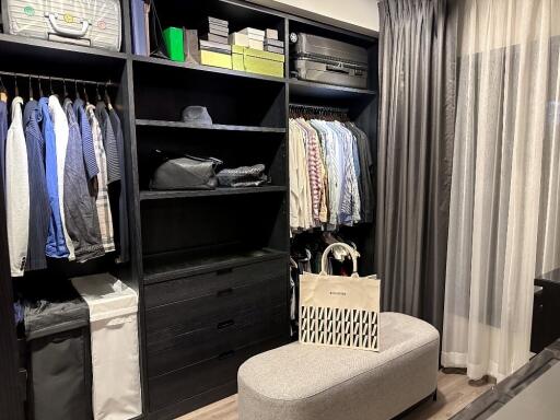 Spacious walk-in closet with organized clothing and accessories storage