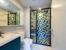 Modern bathroom with geometric shower tiles