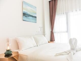 Modern bedroom with artwork and natural light