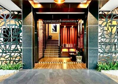 Building entrance with modern decor and intricate metalwork