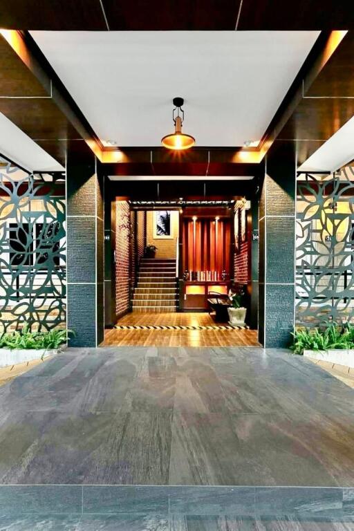 Building entrance with modern decor and intricate metalwork