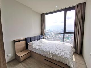 Modern bedroom with large window view