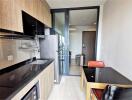 Modern kitchen with dining area and balcony